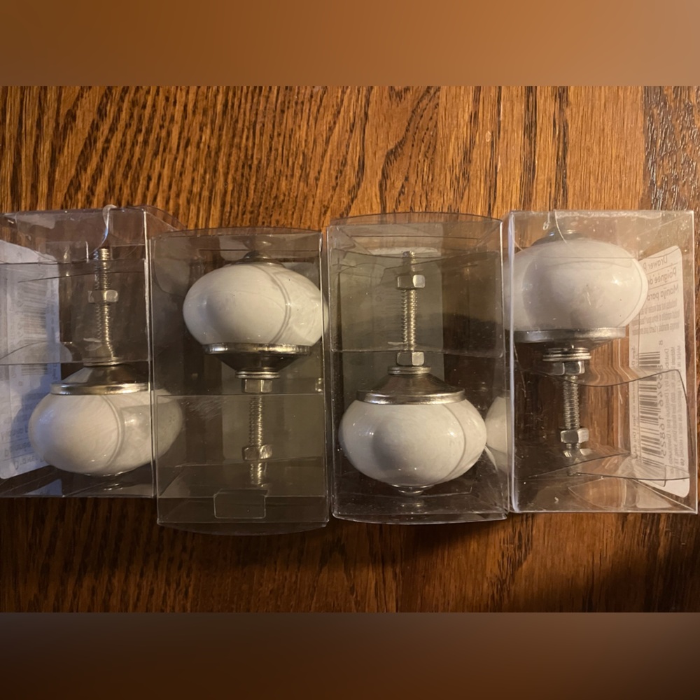 Set of 4 White Ceramic Drawer Knobs never used, still unopened.